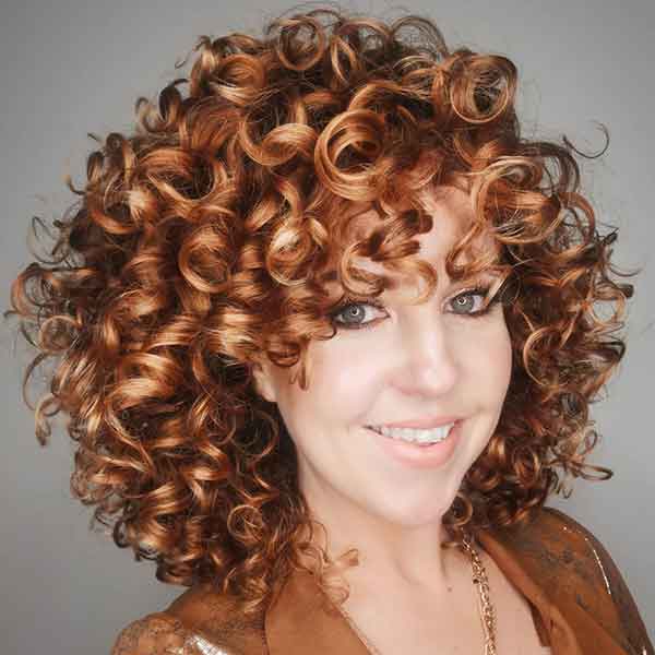 Medium Curly Hair With Bangs And Layers
